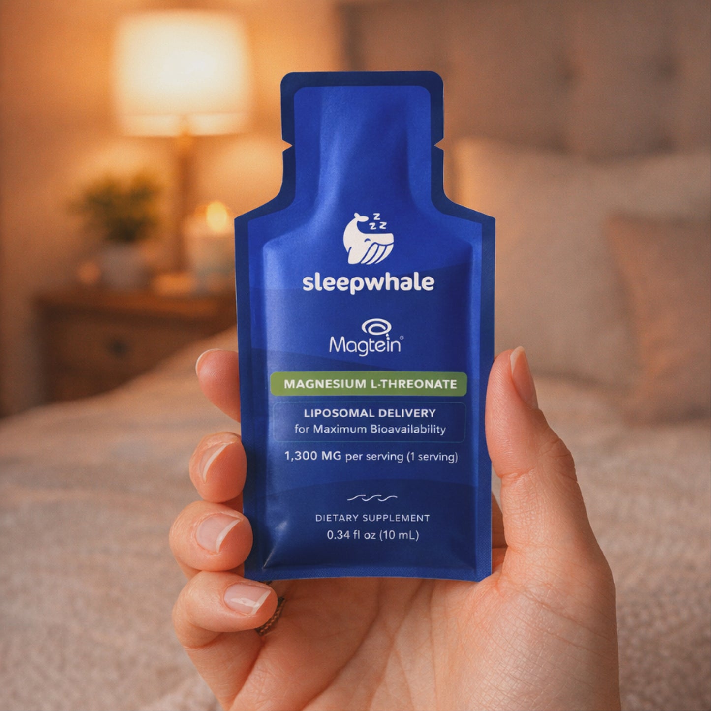 Hand hold a Magtein packet in a bedroom setting